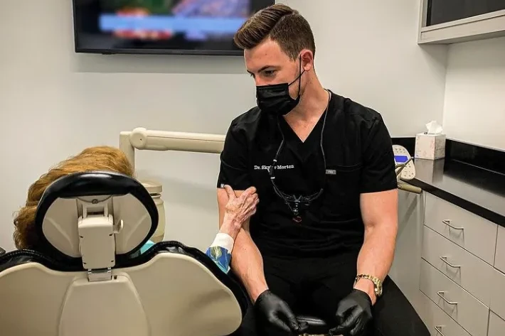 Dr. Morton helping a patient with an emergency | emergency dentist Lawrenceburg, TN